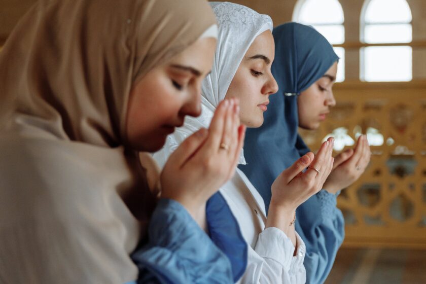 Young girls offering prayers in Dhakka